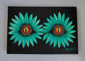A black canvas painting featuring two large green flower-like forms with dragons-eye centres. The artist signature 'Cathy's Art*' is visible in the bottom right corner. Original acrylic canvas painting by Cathy's Art*