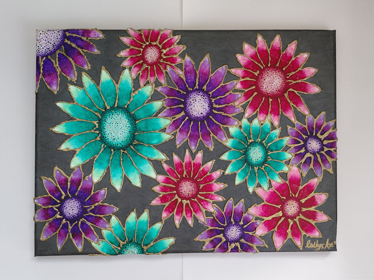 A canvas painting featuring a vibrant pattern of flowers in teal green, magenta pinks, and purples with gold outlines on a dark charcoal grey shimmer background, hung on a white wall. Original acrylic canvas painting with 3D sculptured flowers by Cathy's Art*