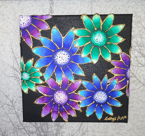 A square black canvas painting featuring vibrant, overlapping daisy-like flowers in shades of blue, purple, and greens, outlined with gold paint. The artwork is displayed against a textured light grey background. Original acrylic sculpture canvas by Cathy's art*