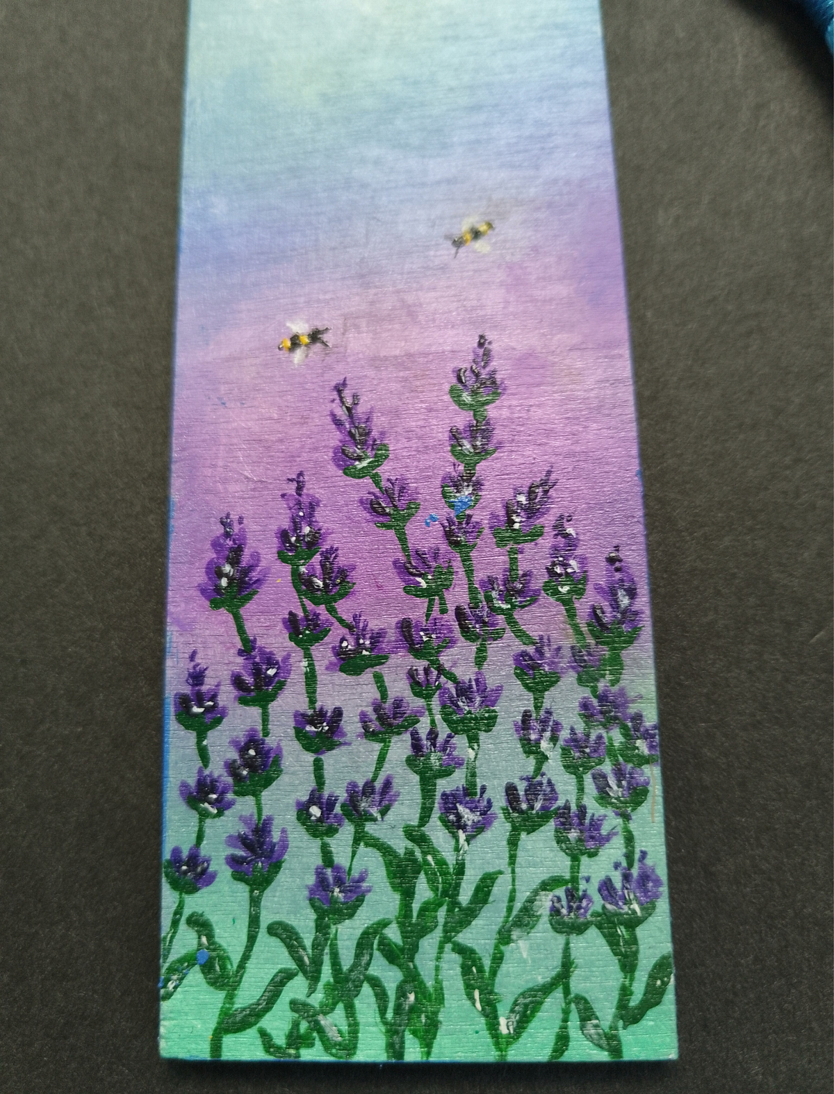 A hand painted close of up of wild lavender, two bees with a blue, purple and green backdrop, on a black background. By Cathy's Art*