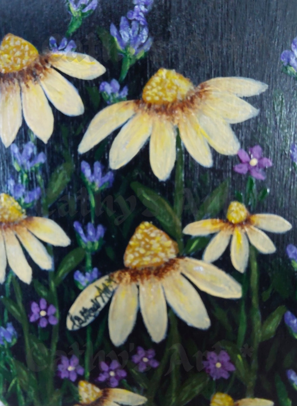 A close up of hand painted yellow daises, purple lavender, and tiny purple flowers on a black background. Original acrylic painting on wooden heart plaque by Cathy's Art*