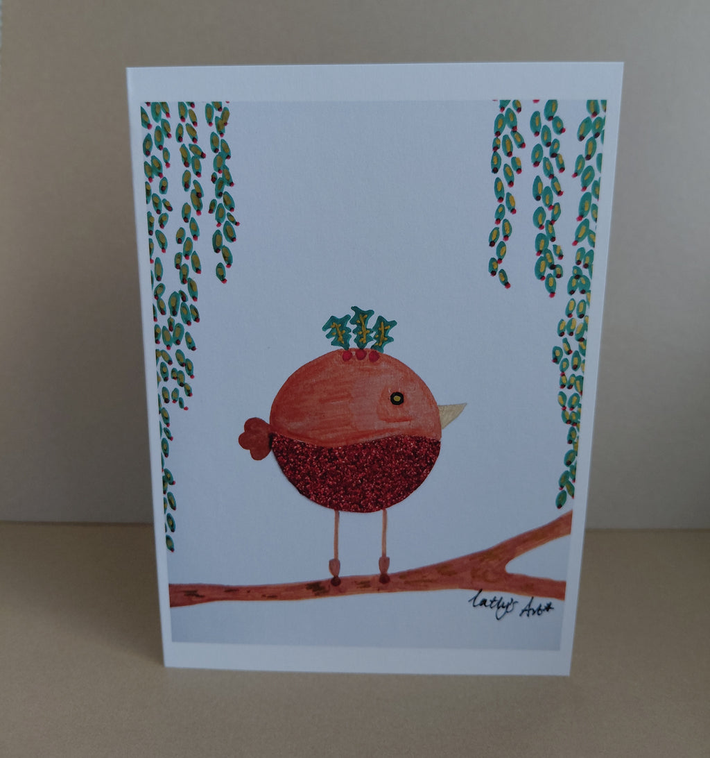 Printed festive Christmas Card featuring a round robin standing on a branch, with holly on its head and leafy foliage hangs down on each side. Original artwork & printed by Cathy's Art*
