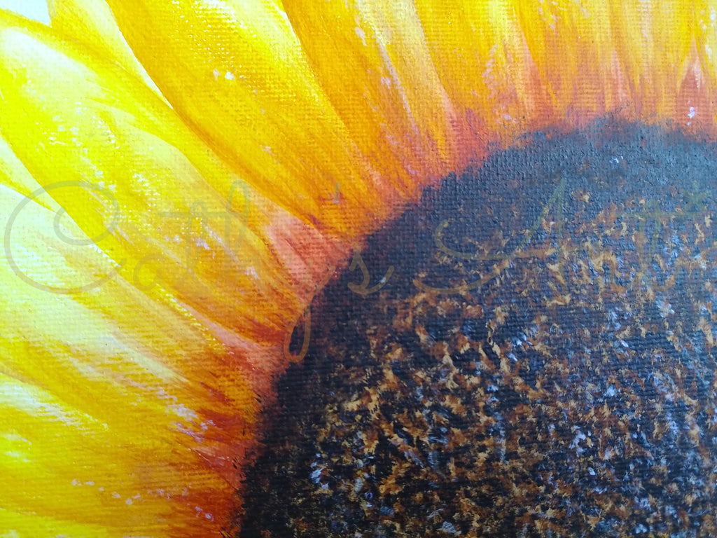 Close-up of a painted sunflower showing bright yellow petals fading into orange and a large dark brown to black centre with visible canvas texture. Original canvas board painting by Cathy's Art*