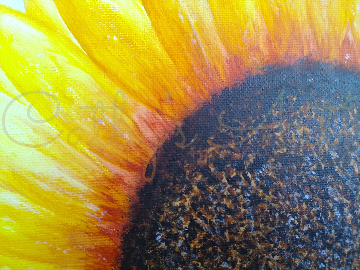 Close-up of a painted sunflower showing bright yellow petals fading into orange and a large dark brown to black centre with visible canvas texture. Original canvas board painting by Cathy's Art*