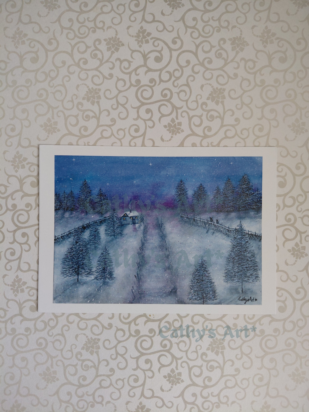 A print of a winter's eve landscape, featuring snow, fir trees, blue and violet sky, a cottage with smoke rising up from the chimney, fences and two owls sat on one of the fences. Artwork by Cathy's Art*